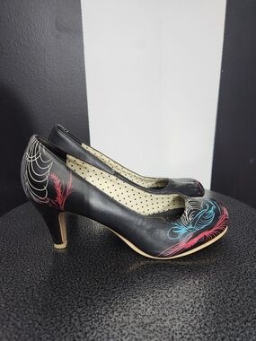 tuk Black Heels with Pink and Blue Feather Motifs